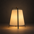 Mons - Wabi Sabi Floor Lamp illuminated against a warm charcoal gallery background