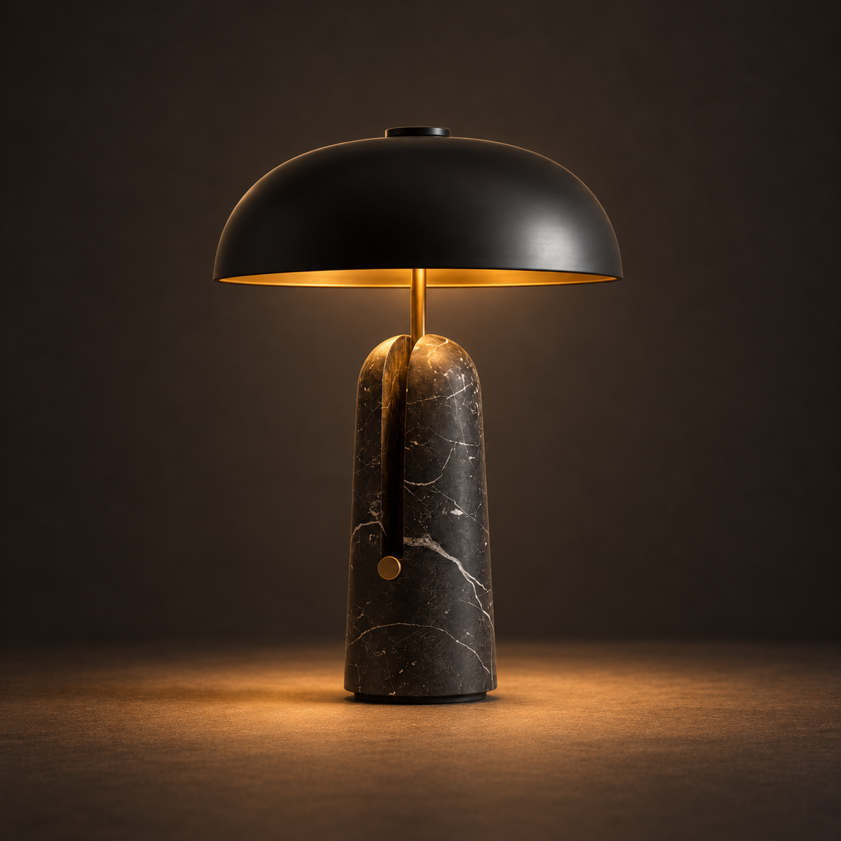 Nero Marble Table Lamp illuminated against a warm charcoal gallery background